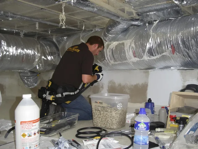 Westborough Air Duct Cleaning specialist performing professional mold removal from air ducts in Westborough