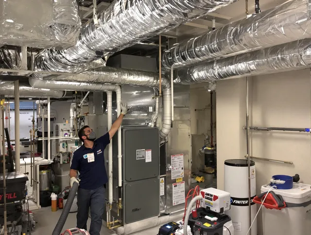 Westborough Air Duct Cleaning specialist performing thorough furnace duct cleaning in a Westborough residence
