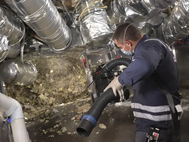 Westborough Air Duct Cleaning specialist operating negative pressure cleaning equipment for thorough duct maintenance in Westborough