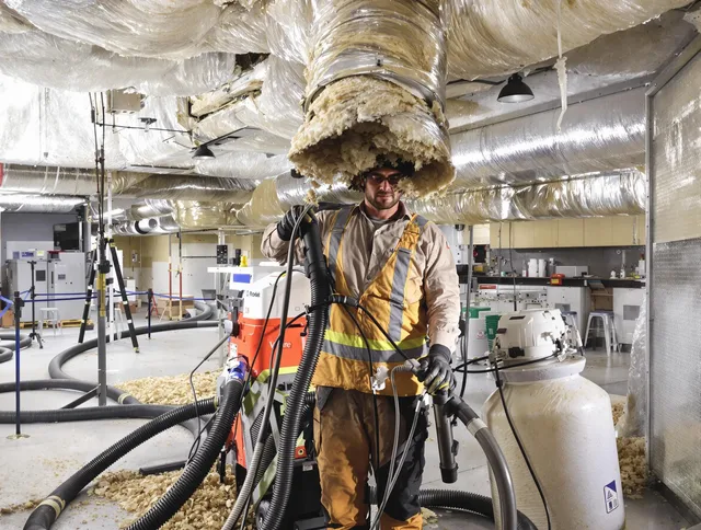 Professional vacuum insulation removal by Westborough Air Duct Cleaning expert in Westborough